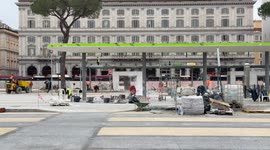 Workers at work at the construction site of the urban redevelopment works in Piazza dei Cinquecento in front of Termini Station in Rome.
