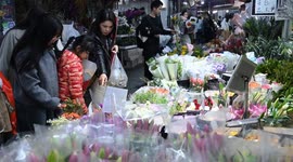 China: Customers buy flowers at a wholesale flower market