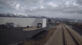 Driver stuck on railway crossing leaps from car seconds before train crashes into vehicle