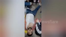 Injured passengers sprawled on floor as train station stampede kills 18 in India