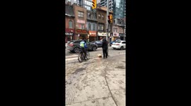 Man sets his shoes on fire on Yonge St in Toronto