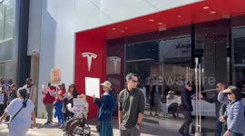 Wailing liberals protest outside Tesla showroom in California