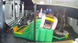 Scary moment bouncy castle topples over as children play