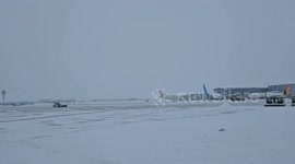 Workers clear snow from airport in Canada