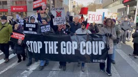 Anti-Trump demonstrators chant “Stop the coup!” at protest march in New York City