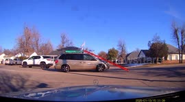 SUV Driver Forgets to Strap Down Ladder