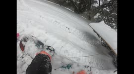 Snowboarder clings onto tractor to glide down roads in Louisiana