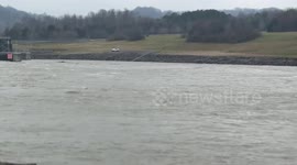 Water surges through dam amid heavy rain in Tennessee