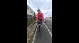 Stray dog runs alongside cyclist and just wants to play