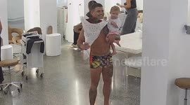 Aussie hairdresser stunned as husband storms into salon in underwear for hilarious Valentine's Day surprise