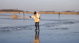 Hundreds flock to frozen lake in the Netherlands despite dozens falling through ice