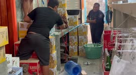 Monitor lizard caught in house tries to escape from wildlife team