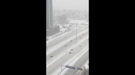 Motorist chases after runaway tyre on snow-covered highway in Toronto