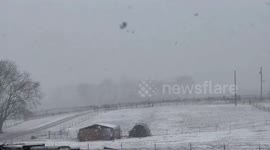 Snow storm blankets fields in fresh powder in Kentucky