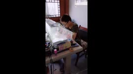 Boy skillfully carves intricate hollow egg sculpture in China