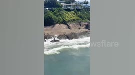 Boy, 12, stranded on rock rescued from choppy sea in Brazil