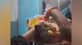 Feral passengers grab food sellers items on train in India