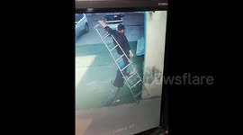 Man falls from ladder and lands safely on colleague's shoulders in hilarious fail