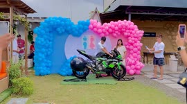 Couple throw awesome gender reveal using motorbike exhaust fumes colour