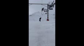 Snowboarder Refuses to Let Go of Lift