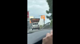 Hot Tub Strapped to Car on Freeway