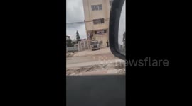 Israeli forces detain a Palestinian youth and search his vehicle at Al-Hamama roundabout in Jenin refugee camp