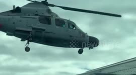 China PLA Navy helicopter flies dangerously close to Filipino aircraft