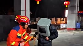 Chinese man gets head stuck in plastic stool after copying viral video - firefighters forced to cut him free