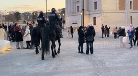 Policemen on horseback patrol Piazza Pia on Christmas Day in Rome.