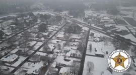 Drone footage shows Alabama city blanketed in snow