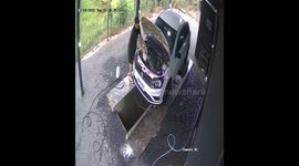 Car Washer Steps Into Water Chute