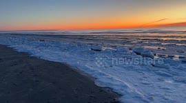 US: Stunning Sunrise Shot At Snow-Covered Beach In Maine