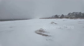 US: Snow-Covered Beach Scene Captured In Norfolk, Virginia 3