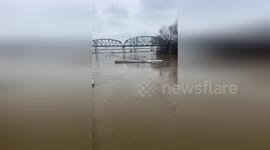 Storm debris surges through Ohio River