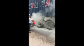 Brave female worker puts out fire under truck