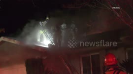 US, Los Angeles: San Bernardino Firefighters Fight Late Night Residential Fire