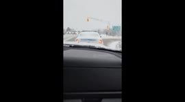 Man Clears Off Back Window Of Canadian Police Cruiser