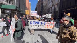 NYC marchers chant: “Trump and Adams have got to go”