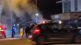 Police Suspect crashes car in police chase, crashing into other driver. Causing car to overturn and set on fire.