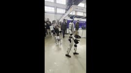 Humanoid robot walks robot dog in Shanghai