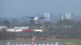 Pilots battle to land at Birmingham Airport during 50mph crosswinds as the UK is hit by weather warnings