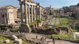 Editorial timelapse overview of the Roman Forum visited by many tourists on a day with spring temperatures in February in Rome.