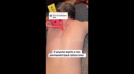 Toy robot draws husband’s temporary tulip tattoo in viral 20 million views video