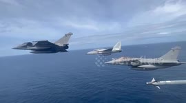 French and Filipino pilots fly alongside each other above Philippine seas