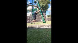 Tourist does loop-the-loop on huge metal triangle swing