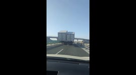 Lorry carrying two truck containers blocks highway in China