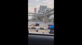 Taxi driver attacks motorcycle rider who 'kicked his car' at junction in Bangkok