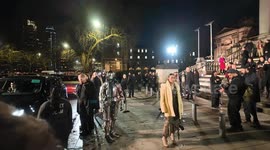 A man dressed as a Knight with custom-built armour arrives at the Burberry Fashion Show at Tate Britain