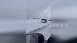 Snow covers Interstate 94 in Michigan