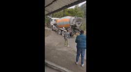 Driver escapes as cement truck capsizes into ditch in China